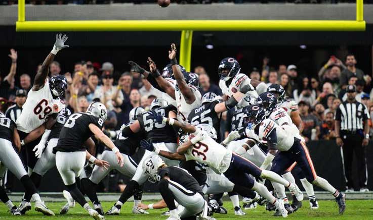 Chicago Bears cornerback Josh Blackwell blocks Raiders kicker Daniel Carlson's field goal attempt